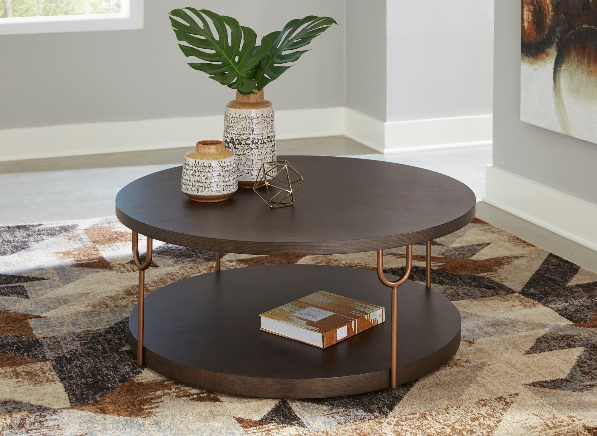 Hugh Dark Brown Round Cocktail Table - Image 1