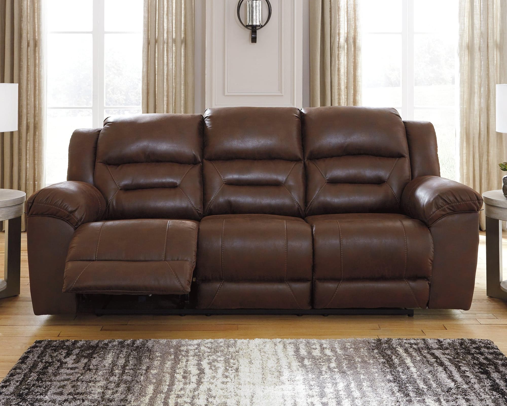 Stoneland Chocolate Faux Leather Power Reclining Sofa - Image 1