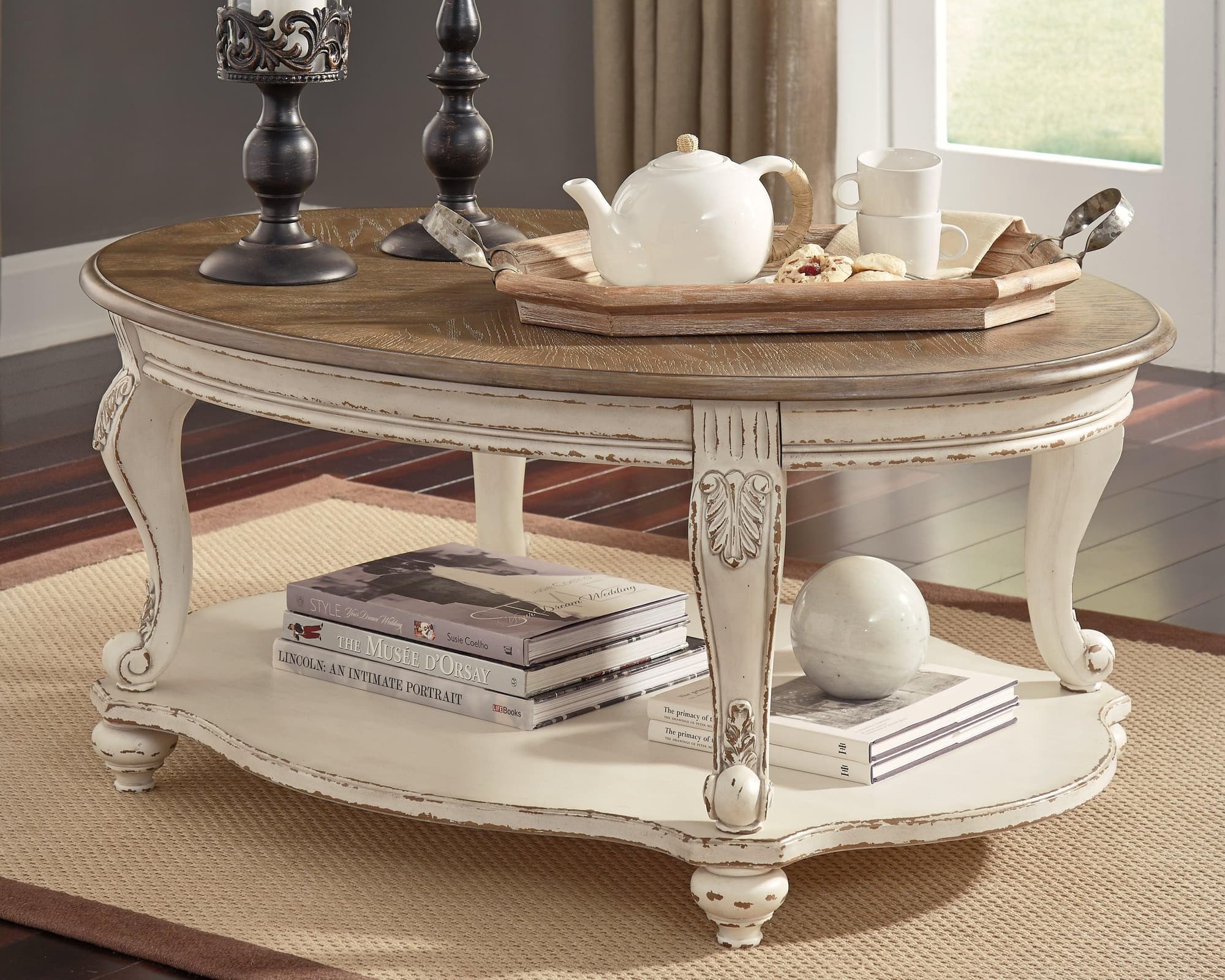 Realyn White Brown Coffee Table - Image 1