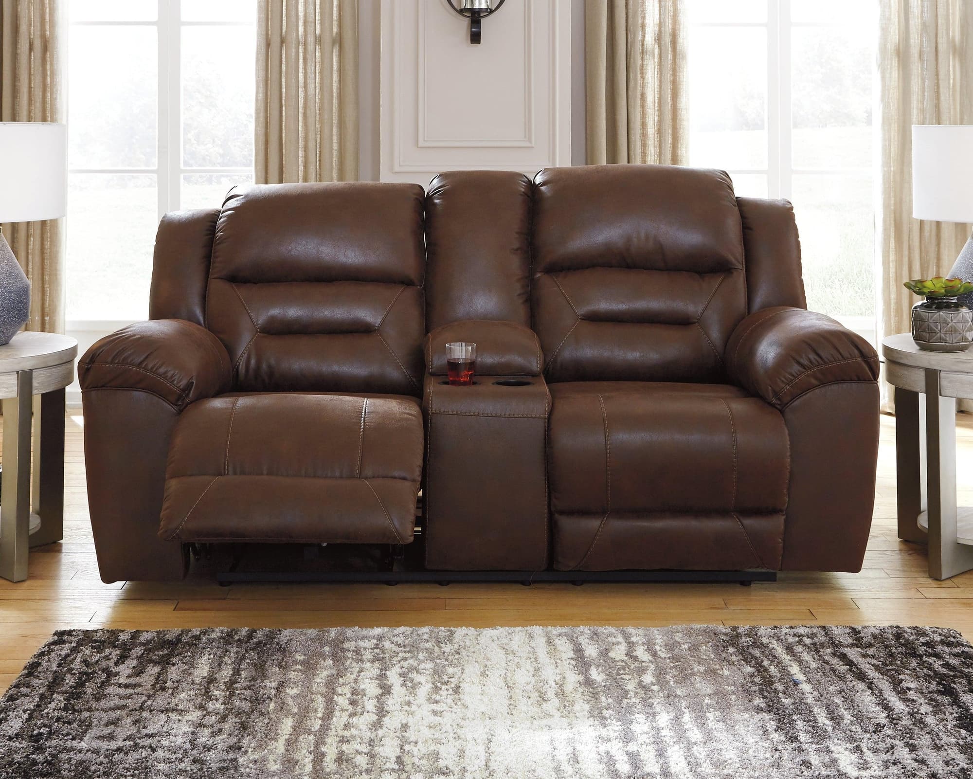 Stoneland Chocolate Faux Leather Power Reclining Loveseat With Console - Image 1