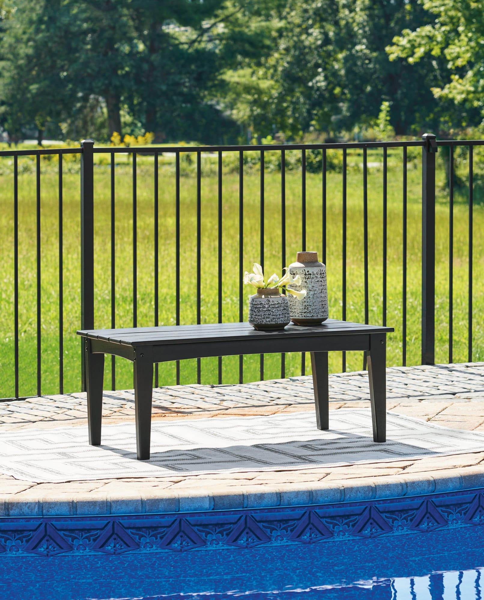 Hyland Wave Black Outdoor Coffee Table - Image 1