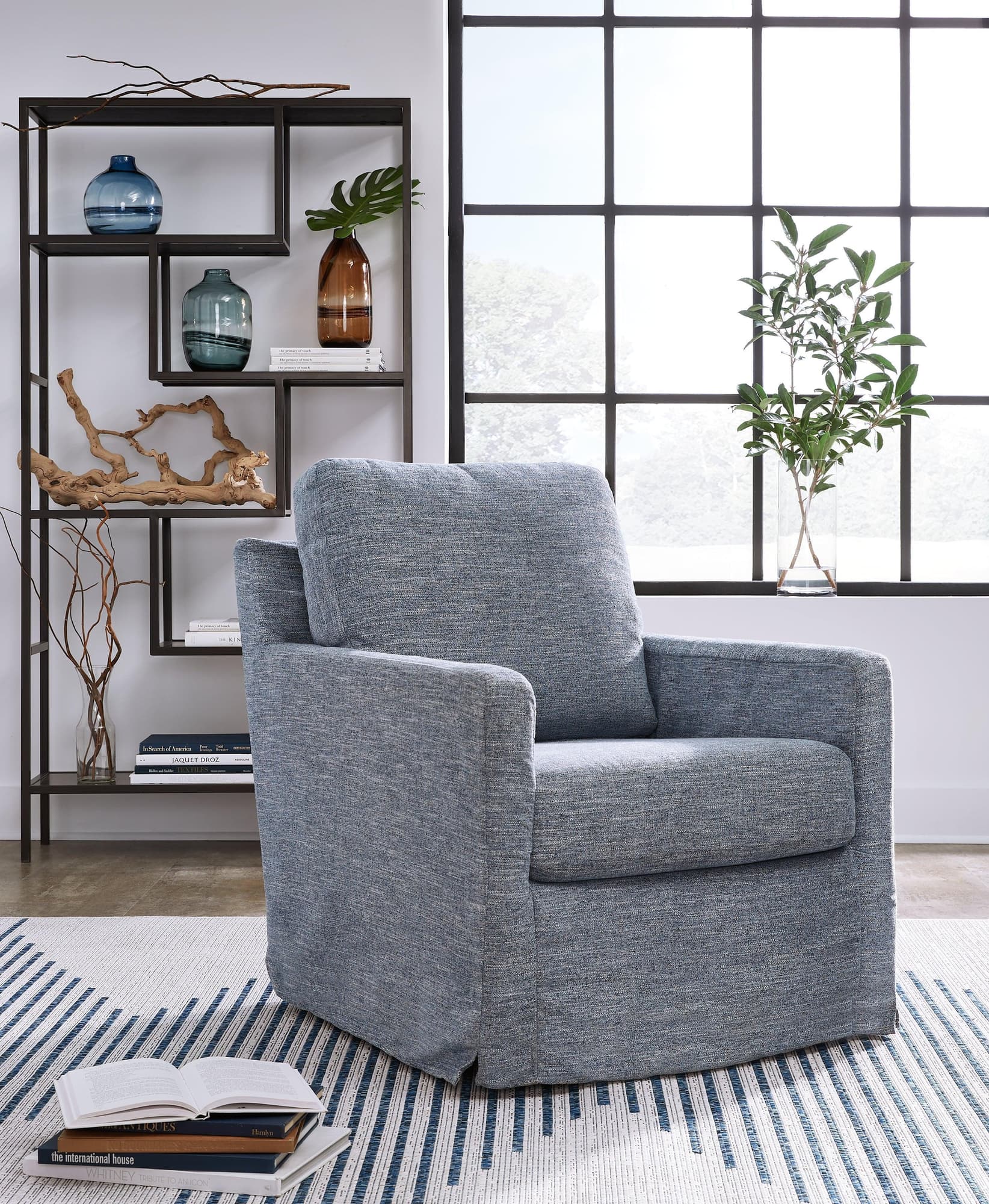 Nenana Next-Gen Nuvella Denim Swivel Glider Accent Chair - Image 1