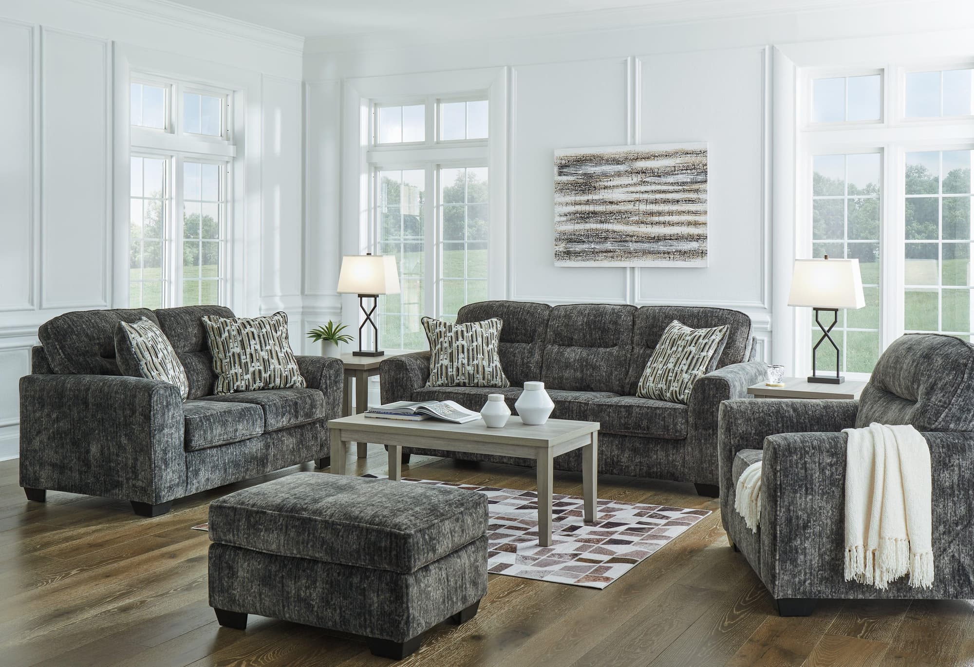 Lonoke Gunmetal Sofa Loveseat Chair And Ottoman - Image 1