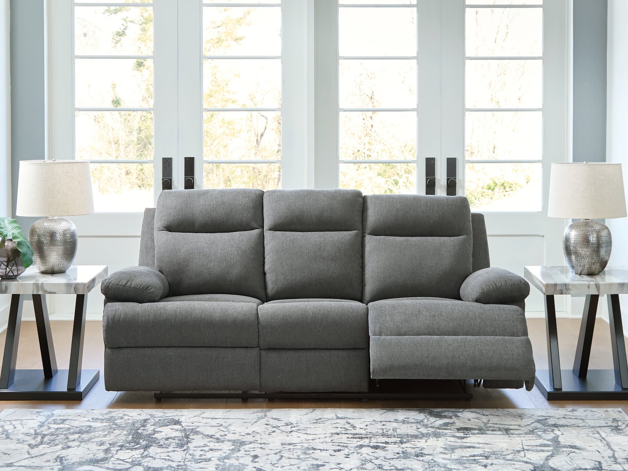 Side-Swipe Charcoal Chenille Reclining Sofa with Drop Down Table - Image 1