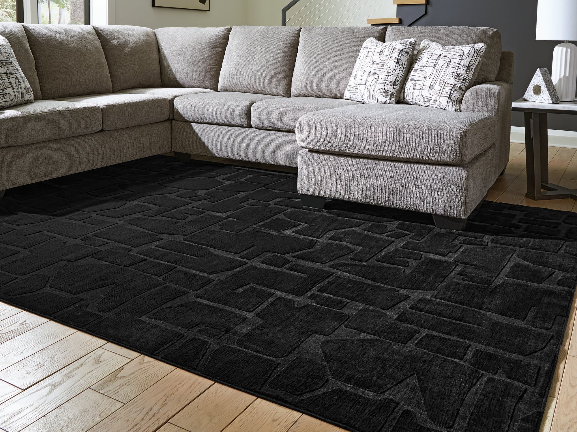 Gibbswell Black Washable 8' x 10' Area Rug - Image 1