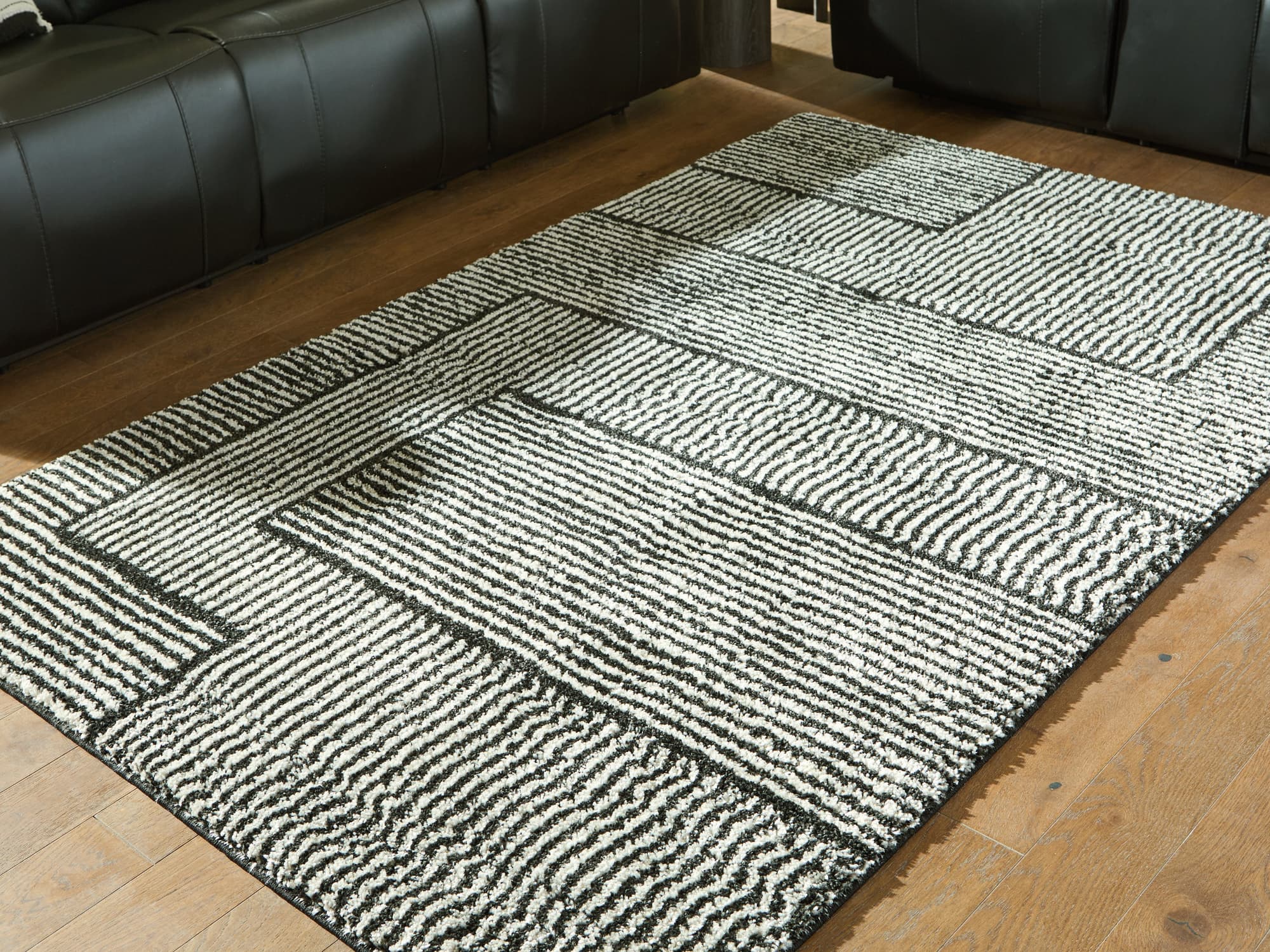 Kurtmen Black/Ivory 5' x 7' Area Rug - Image 1