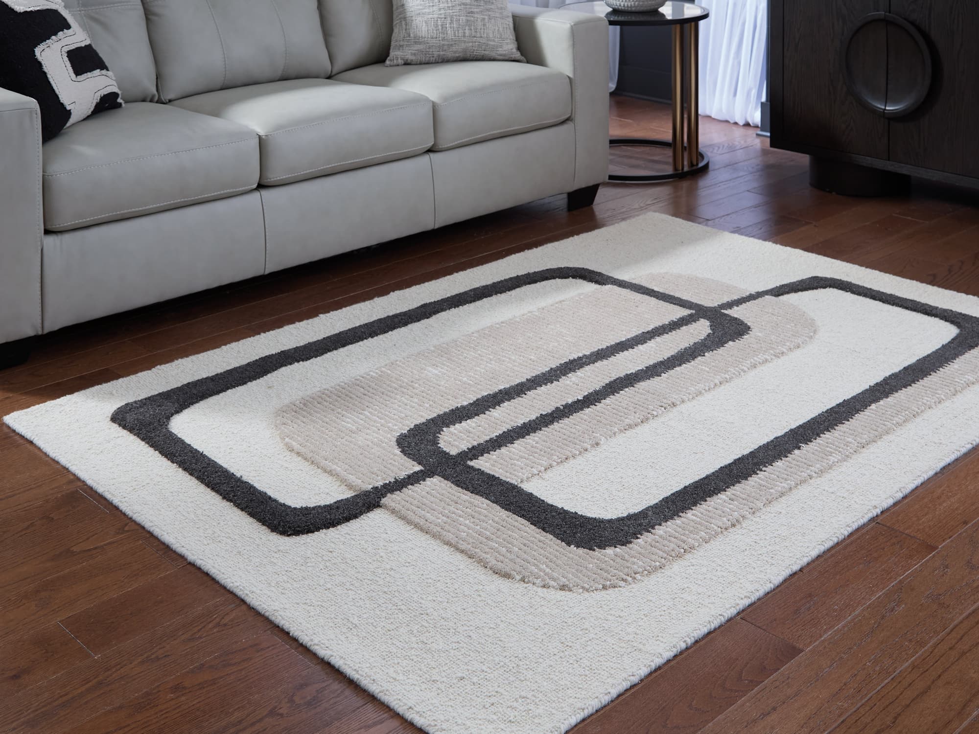 Davismour Ivory/Taupe/Charcoal 5′ x 7′ Area Rug